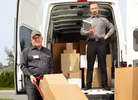 Student removals team handling boxes in Dartford during a local move