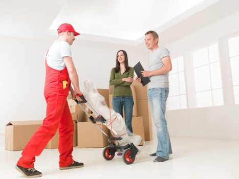 Unpacking boxes into the right rooms after moving to a Dartford property