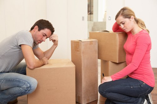 Furniture removals team handling heavy items in a Dartford home