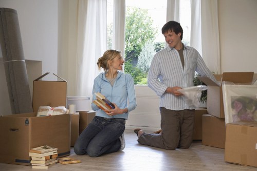 Packed office equipment and furniture prepared for a Dartford commercial move