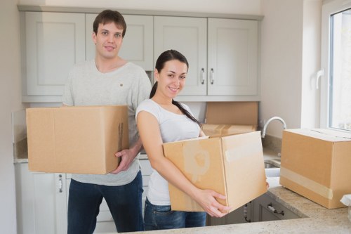 Packed boxes and furniture prepared for a flat removal in Dartford